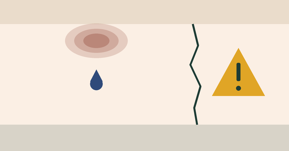 A ceiling water stain with a drip, a wall crack and a warning sign